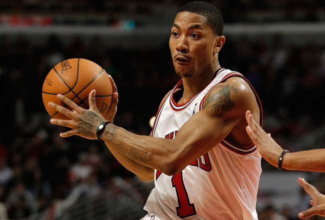 CHICAGO - MARCH 30: Derrick Rose #1 of the Chicago Bulls looks to pass against the Phoenix Suns at the United Center on March 30, 2010 in Chicago, Illinois. The Suns defeated the Bulls 111-105. NOTE TO USER: User expressly acknowledges and agrees that, by downloading and/or using this Photograph, User is consenting to the terms and conditions of the Getty Images License Agreement. (Photo by Jonathan Daniel/Getty Images)