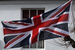 WOOTTON BASSETT, ENGLAND - FEBRUARY 12:  A Union Jack flag flies at half mast as mourners react as the hearses carrying the bodies of Private Sean McDonald, Corporal Johnathan Moore and Warrant Officer Class 2 David Markland - a bomb disposal expert - pass along the High Street on February 12 2009, in Wootton Bassett, England. Cpl Moore, 22, and Pte McDonald, 26, of The Royal Scots Borderers, 1st Battalion The Royal Regiment of Scotland, were killed in an explosion near Sangin on February 7. Their deaths pushed the numbers of soldiers killed in Afghanistan since 2001, past that of the 255 killed in the Falklands War in 1982. WO2 Markland, 36, was killed in another IED blast the following day. The repatriation came as a 15,000-strong force of coalition and Afghan troops made final preparations for a major offensive against the Taliban in Helmand Province.  (Photo by Matt Cardy/Getty Images)