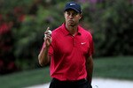 AUGUSTA, GA - APRIL 11:  Tiger Woods celebrates after a birdie putt on the 13th hole during the final round of the 2010 Masters Tournament at Augusta National Golf Club on April 11, 2010 in Augusta, Georgia.  (Photo by Harry How/Getty Images)