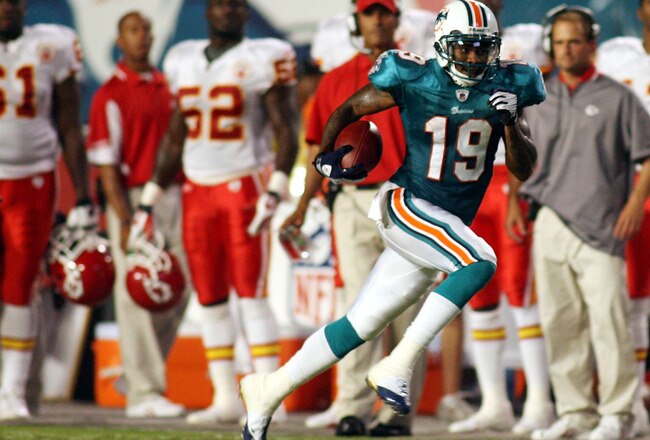 MIAMI - AUGUST 23:  Punt returner Ted Ginn Jr. #19 of the Miami Dolphinsruns for a 59 yard touchdown return during a pre season game against the Kansas City Chiefs on August 23, 2008 at Dolphin Stadium in Miami, Florida.  (Photo by Marc Serota/Getty Images)