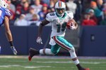 ORCHARD PARK, NY - NOVEMBER 29:  Ted Ginn Jr. #19 of the Miami Dolphins carries the ball during the game against the Buffalo Bills at Ralph Wilson Stadium on November 29, 2009 in Orchard Park, New York. Buffalo won 31-14. (Photo by Rick Stewart/Getty Images)