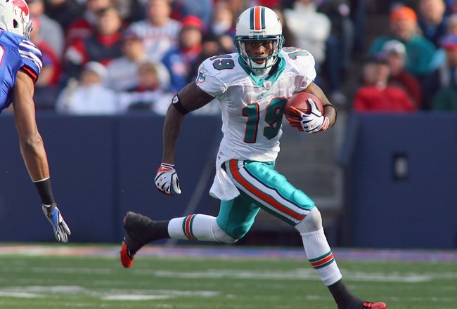 ORCHARD PARK, NY - NOVEMBER 29:  Ted Ginn Jr. #19 of the Miami Dolphins carries the ball during the game against the Buffalo Bills at Ralph Wilson Stadium on November 29, 2009 in Orchard Park, New York. Buffalo won 31-14. (Photo by Rick Stewart/Getty Images)