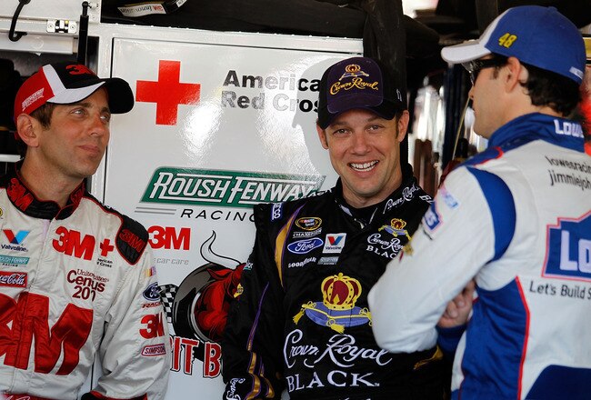 PHOENIX - APRIL 09:  (L-R) Greg Biffle, driver of the #16 3M Ford, Matt Kenseth, driver of the #17 Crown Royal Black Ford, and Jimmie Johnson, driver of the #48 Lowe's Chevrolet, talk during practice for the NASCAR Sprint Cup Series Subway Fresh Fit 600 at Phoenix International Raceway on April 9, 2010 in Phoenix, Arizona.  (Photo by Todd Warshaw/Getty Images for NASCAR)