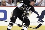 PITTSBURGH - APRIL 14:  Sidney Crosby #87 of the Pittsburgh Penguins makes a pass against the Ottawa Senators in Game One of the Eastern Conference Quarterfinals during the 2010 NHL Stanley Cup Playoffs at Mellon Arena on April 14, 2010 in Pittsburgh, Pennsylvania.  The Senators defeated the Penguins 5-4.  (Photo by Justin K. Aller/Getty Images)