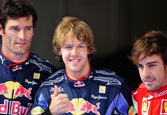 SHANGHAI, CHINA - APRIL 17: Pole sitter Sebastian Vettel (C) of Germany and Red Bull Racing celebrates in parc ferme alongside second placed Mark Webber (L) of Australia and Red Bull Racing and third placed Fernando Alonso (R) of Spain and Ferrari following qualifying for the Chinese Formula One Grand Prix at the Shanghai International Circuit on April 17, 2010 in Shanghai, China. (Photo by Clive Mason/Getty Images)