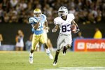 PASADENA, CA - SEPTEMBER 19:  Brandon Banks #83 of the Kansas State Wildcats returns the ball while being pursued by Damien Thigpen #25 of the UCLA Bruins at the Rose Bowl on September 19, 2009 in Pasadena, California. UCLA defeated Kansas State 23-9.  (Photo by Jeff Gross/Getty Images)