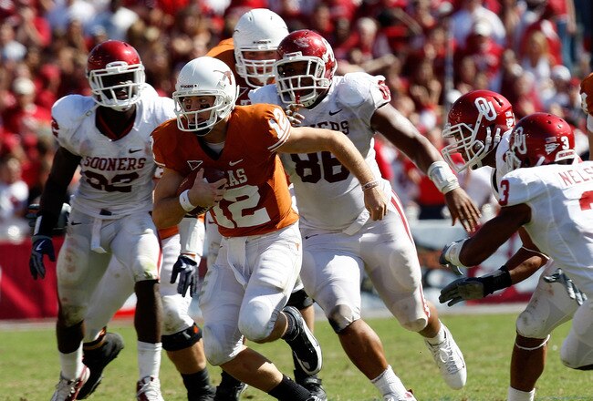 DALLAS - OCTOBER 17:  Quarterback Colt McCoy #12 of the Texas Longhorns runs the ball against the Oklahoma Sooners at Cotton Bowl on October 17, 2009 in Dallas, Texas.  (Photo by Ronald Martinez/Getty Images)