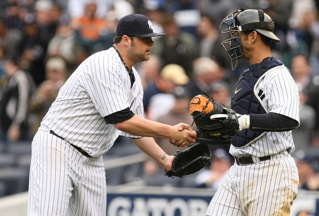 NEW YORK - APRIL 17:  Joba Chamberlain #62 (L) and Jorge Posada #20 of The New York Yankees celebrate their 7-3 victory against  the Texas Rangers during their game on April 17, 2010 at Yankee Stadium in the Bronx Borough of New York City.  (Photo by Al Bello/Getty Images)