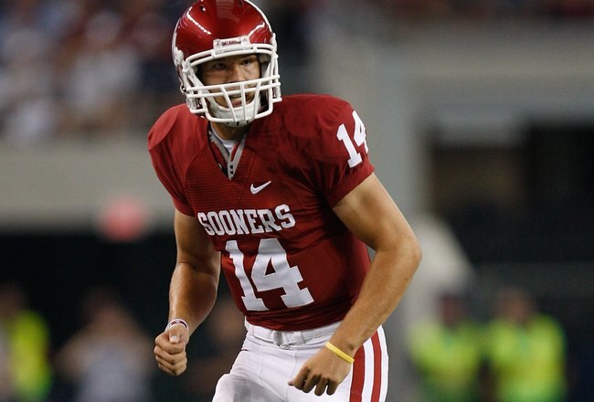 ARLINGTON, TX - SEPTEMBER 05:  Quarterback Sam Bradford #14 of the Oklahoma Sooners lines up for a play at Cowboys Stadium on September 5, 2009 in Arlington, Texas.  (Photo by Ronald Martinez/Getty Images)