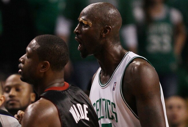 BOSTON - APRIL 17:  Kevin Garnett #5 of the Boston Celtics exchanges words with members of the Miami Heat bench after teammate Paul Pierce was shoved into the Heat bench during Game One of the Eastern Conference Quarterfinals of the 2010 NBA playoffs at the TD Garden on April 17, 2010 in Boston, Massachusetts. The Celtics defeated the Heat 85-76.   (Photo by Elsa/Getty Images)