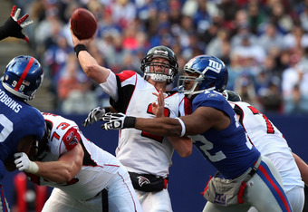 EAST RUTHERFORD, NJ - NOVEMBER 22:  Matt Ryan #2 of the Atlanta Falcons throws a pass under pressure from Osi Umenyiora #72 of the New York Giants on November 22, 2009 at Giants Stadium in East Rutherford, New Jersey. The Giants defeated the Falcons 34-31 in overtime.  (Photo by Jim McIsaac/Getty Images)
