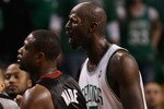 BOSTON - APRIL 17:  Kevin Garnett #5 of the Boston Celtics exchanges words with members of the Miami Heat bench after teammate Paul Pierce was shoved into the Heat bench during Game One of the Eastern Conference Quarterfinals of the 2010 NBA playoffs at the TD Garden on April 17, 2010 in Boston, Massachusetts. The Celtics defeated the Heat 85-76.   (Photo by Elsa/Getty Images)