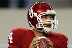 ARLINGTON, TX - SEPTEMBER 05:  Quarterback Sam Bradford #14 of the Oklahoma Sooners drops back to pass against the Brigham Young Cougars at Cowboys Stadium on September 5, 2009 in Arlington, Texas.  (Photo by Ronald Martinez/Getty Images)