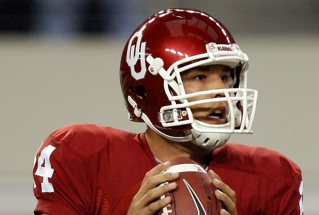 ARLINGTON, TX - SEPTEMBER 05:  Quarterback Sam Bradford #14 of the Oklahoma Sooners drops back to pass against the Brigham Young Cougars at Cowboys Stadium on September 5, 2009 in Arlington, Texas.  (Photo by Ronald Martinez/Getty Images)