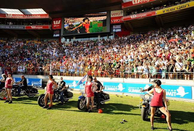 WELLINGTON, NEW ZEALAND - FEBRUARY 06:  Dancers are delivered onto the ground by Harley Davidsons' to entertain the crowd during day two of the Wellington IRB Sevens at Westpac Stadium on February 6, 2010 in Wellington, New Zealand.  (Photo by Ross Land/Getty Images)