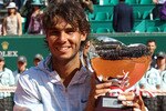 MONTE CARLO, MONACO - APRIL 18:  Rafael Nadal of Spain with the trophy after defeating Fernando Verdasco of Spain in the final during day Seven of the ATP Masters Series at the Monte Carlo Country Club on April 18, 2010 in Monte Carlo, Monaco.  (Photo by Julian Finney/Getty Images)