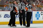 PHILADELPHIA - APRIL 11:  Referee Kerry Fraser #2 (L) is honored during the game between the New York Rangers and the Philadelphia Flyers by linesman Don Henderson and referee Kelly Sutherland (R) as they wear Fraser's #2 on their jerseys on April 11, 2010 at Wachovia Center in Philadelphia, Pennsylvania. The game was Fraser's final game in the NHL as he is retiring after 30 years in the league.The Flyers defeated the Rangers 2-1 after a shootout. The victory clinched a playoff berth for Philadelphia.  (Photo by Jim McIsaac/Getty Images)