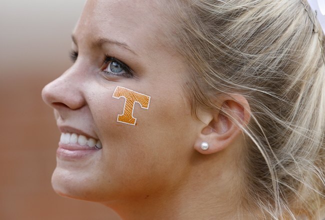 KNOXVILLE, TN - SEPTEMBER 12: A cheerleader of the Tennessee Volunteers smiles from the sideline against the UCLA Bruins on September 12, 2009 at Neyland Stadium in Knoxville, Tennessee. UCLA beat Tennessee 19-15. (Photo by Joe Murphy/Getty Images)
