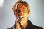 NEWPORT, ENGLAND - JUNE 13:  David Bowie performs on stage on the third and final day of 'The Nokia Isle of Wight Festival 2004' at Seaclose Park, on June 13, 2004 in Newport, UK. The third annual rock festival takes place during the Isle of Wight Festival which runs from June 4-19.  (Photo by Jo Hale/Getty Images)