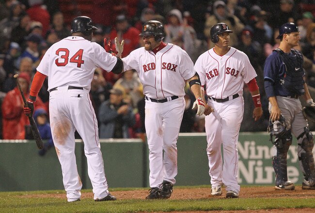 BOSTON - APRIL 17:  Kevin Youkilis #20 of the Boston Red Sox hits a home run against the Tampa Bay Rays at Fenway Park on April 17, 2010 in Boston, Massachusetts. (Photo by Jim Rogash/Getty Images)