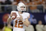ARLINGTON, TX - DECEMBER 5: Colt McCoy #12 of the Texas Longhorns looks to pass the ball during the Big 12 Football Championship game against the Nebraska Cornhuskers at Cowboys Stadium on December 5, 2009 in Arlington, Texas. (Photo by Jamie Squire/Getty Images)