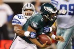 ARLINGTON, TX - JANUARY 09:  Quarterback Donovan McNabb #5 of the Philadelphia Eagles is sacked by Bradie James #56 of the Dallas Cowboys during the 2010 NFC wild-card playoff game at Cowboys Stadium on January 9, 2010 in Arlington, Texas.  (Photo by Ronald Martinez/Getty Images)