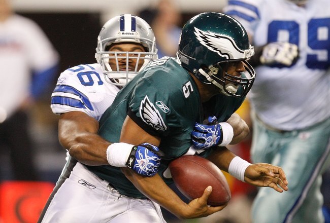 ARLINGTON, TX - JANUARY 09:  Quarterback Donovan McNabb #5 of the Philadelphia Eagles is sacked by Bradie James #56 of the Dallas Cowboys during the 2010 NFC wild-card playoff game at Cowboys Stadium on January 9, 2010 in Arlington, Texas.  (Photo by Ronald Martinez/Getty Images)
