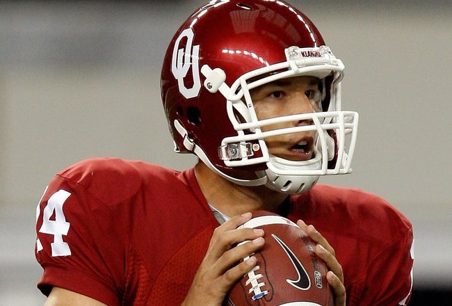ARLINGTON, TX - SEPTEMBER 05:  Quarterback Sam Bradford #14 of the Oklahoma Sooners drops back to pass against the Brigham Young Cougars at Cowboys Stadium on September 5, 2009 in Arlington, Texas.  (Photo by Ronald Martinez/Getty Images)