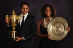 LONDON - JULY 5:  (EDITORS NOTE: THIS IMAGE IS A COMPOSITE OF TWO SEPERATE PORTRAITS) In this handout image provided by the AELTC, Roger Federer of Switzerland,  the Mens Singles Champion 2009 and Serena Williams of the United States, the Ladies Singles Champion 2009 pose with their trophies at the Champions Dinner at the Intercontinental Hotel Park Lane on July 5, 2009 in London, England. (Photo by AELTC/Bob Martin via Getty Images)