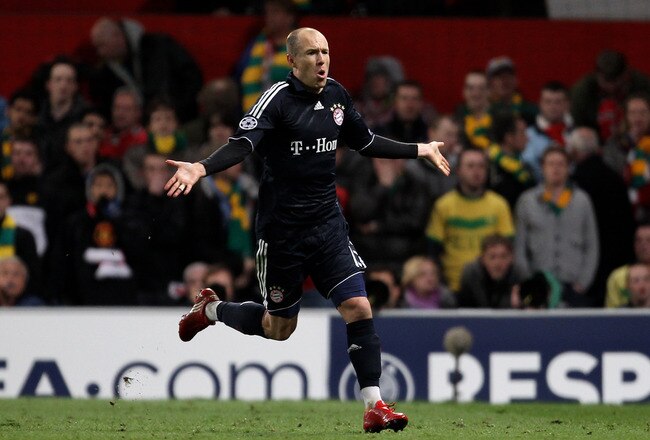 MANCHESTER, ENGLAND - APRIL 07:  Arjen Robben of Bayern Muenchen celebrates scoring his team's second goal during the UEFA Champions League Quarter Final second leg match between Manchester United and Bayern Muenchen at Old Trafford on April 7, 2010 in Manchester, England.  (Photo by Alex Livesey/Getty Images)