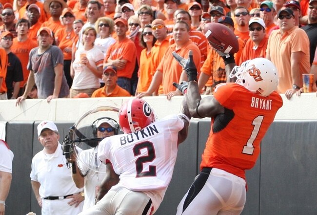 STILLWATER, OK - SEPTEMBER 5:  Runningback Brandon Boykin #2 of the Georgia Bulldogs dives for the ball for the ball as Dez Bryant #1 of the Oklahoma State Cowboys cannot make the pass during the third quarter of the game at Boone Pickens Stadium on September 5, 2009 in Stillwater, Oklahoma. (Photo by Christian Petersen/Getty Images)