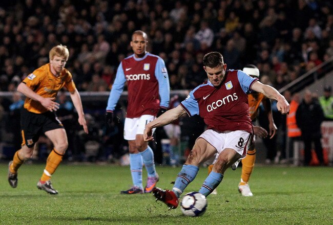 HULL, ENGLAND - APRIL 21:  James Milner of Aston Villa scores the second goal from the penalty spot during the Barclays Premier League match between Hull City and Aston Villa at the KC Stadium on April 21, 2010 in Hull, England.  (Photo by Alex Livesey/Getty Images)