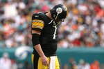 MIAMI - JANUARY 03:  Quarterback Ben Roethlisberger #7 of the Pittsburgh Steelers walks back to the huddle after injuring his shoulder in the fourth quarter against the Miami Dolphins at Land Shark Stadium on January 3, 2010 in Miami, Florida. The Steelers defeated the Dolphins 30-24.  (Photo by Doug Benc/Getty Images)