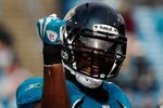 JACKSONVILLE, FL - DECEMBER 06:  Quentin Groves #54 of the Jacksonville Jaguars celebrates after a defensive play during the game against the Houston Texans at Jacksonville Municipal Stadium on December 6, 2009 in Jacksonville, Florida.  (Photo by Sam Greenwood/Getty Images)