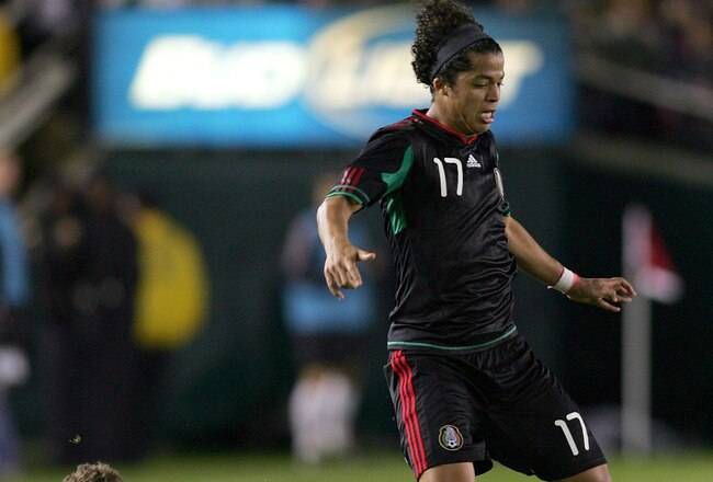 PASADENA, CA - MARCH 03:  Tony Lochead #3 of New Zealand slides in for the tackle on Giovani Dos Santos #17 of Mexico in the second half during their International Friendly match at the Rose Bowl on March 3, 2010 in Pasadena, California.  (Photo by Victor Decolongon/Getty Images)