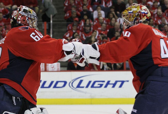 WASHINGTON - APRIL 17: Semyon Varlamov #40 (R) of the Washington Capitals takes over goaltender duties from Jose Theodore #60 (L) in the first period of their game against the Montreal Canadiens in Game Two of the Eastern Conference Quarterfinals during the 2010 NHL Stanley Cup Playoffs at the Verizon Center on April 17, 2010 in Washington, DC.  (Photo by Bruce Bennett/Getty Images)