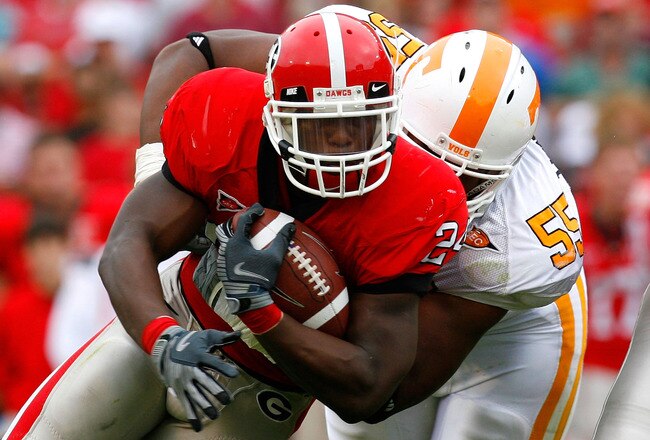 ATHENS, GA - OCTOBER 11:  Dan Williams #55 of the Tennessee Volunteers tackles Knowshon Moreno #24 of the Georgia Bulldogs at Sanford Stadium on October 11, 2008 in Athens, Georgia.  (Photo by Kevin C. Cox/Getty Images)