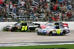 FORT WORTH, TX - APRIL 19:  Jeff Gordon, driver of the #24 DuPont / National Guard Special Forces Chevrolet is hit from behind by Tony Stewart, driver of the #14 Office Depot / Old Spice Chevrolet as Jimmie Johnson, driver of the #48 Lowe's Chevrolet drives by during the NASCAR Sprint Cup Series Samsung Mobile 500 at Texas Motor Speedway on April 19, 2010 in Fort Worth, Texas.  (Photo by Jerry Markland/Getty Images for NASCAR)