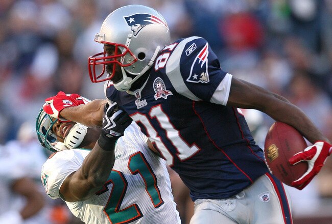 FOXBORO, MA - NOVEMBER 8:  Randy Moss #81 of the New England Patriots gains yards against the defense of Vontae Davis of the Miami Dolphins at Gillette Stadium on November 8, 2009 in Foxboro, Massachusetts. The Patriots won 27-17. (Photo by Jim Rogash/Getty Images)