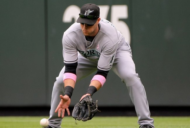 DENVER - MAY 10:  Jeremy Hermida #27 of the Florida Marlins fields a ball against the Colorado Rockies during MLB action at Coors Field on May 10, 2009 in Denver, Colorado. The Rockies defeated the Marlins 3-2.  (Photo by Doug Pensinger/Getty Images)