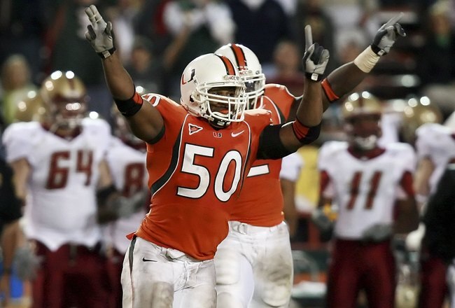 MIAMI - NOVEMBER 23:  Linebacker Darryl Sharpton #50 of the University of Miami Hurricanes celebrates a drive ending interception in the fourth quarter by the Boston College Golden Eagles at the Orange Bowl Stadium on November 23, 2006 in Miami, Florida. Miami defeated Boston College 17-10.  (Photo by Doug Benc/Getty Images)
