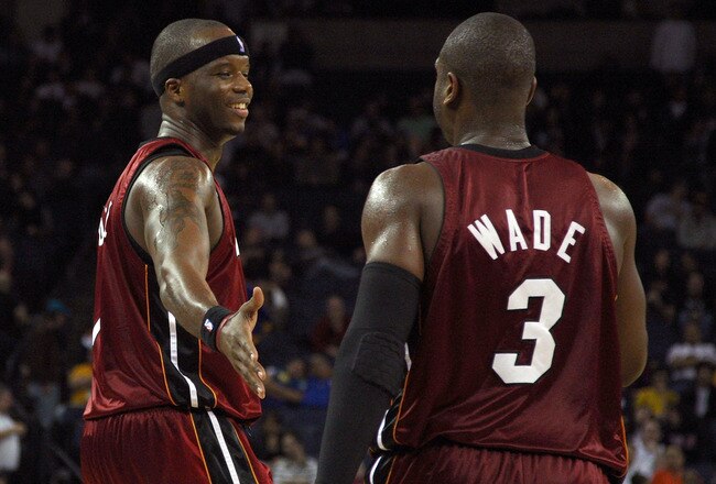 OAKLAND, CA - JANUARY 13:  Jermaine O'Neal #7 of the Miami Heat celebrates with teammate Dwyane Wade #3  during an NBA game against the Golden State Warriors at Oracle Arena on January 13, 2010 in Oakland, California.  NOTE TO USER: User expressly acknowledges and agrees that, by downloading and/or using this Photograph, user is consenting to the terms and conditions of the Getty Images License Agreement.  (Photo by Jed Jacobsohn/Getty Images)