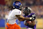 GLENDALE, AZ - JANUARY 04:  Kyle Wilson #1 of the Boise State Broncos attempts to strip the ball from Jeremy Kerley #85 of the TCU Horned Frogs in the third quarter during the Tostitos Fiesta Bowl at the Universtity of Phoenix Stadium on January 4, 2010 in Glendale, Arizona.  (Photo by Christian Petersen/Getty Images)