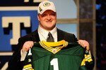 NEW YORK - APRIL 22:  Bryan Bulaga from the Iowa Hawkeyes holds up a Green Bay Packers jersey after the Packers drafted him number 23 overall during the first round of the 2010 NFL Draft at Radio City Music Hall on April 22, 2010 in New York City.  (Photo by Jeff Zelevansky/Getty Images)