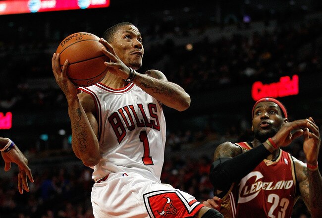 CHICAGO - APRIL 25: Derrick Rose #1 of the Chicago Bulls drives to the basket past LeBron James #23 of the Cleveland Cavaliers in Game Four of the Eastern Conference Quarterfinals during the 2010 NBA Playoffs at the United Center on April 25, 2010 in Chicago, Illinois. The Cavaliers defeated the Bulls 121-98. NOTE TO USER: User expressly acknowledges and agrees that, by downloading and/or using this Photograph, User is consenting to the terms and conditions of the Getty Images License Agreement. (Photo by Jonathan Daniel/Getty Images)
