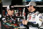 FONTANA, CA - FEBRUARY 20:  Jeff Gordon, driver of the #24 DuPont Chevrolet, and Jimmie Johnson, driver of the #48 Lowe's/Kobalt Tools Chevrolet, talk in the garage area during practice for the NASCAR Sprint Cup Series Auto Club 500 at Auto Club Speedway on February 20, 2010 in Fontana, California.  (Photo by Jason Smith/Getty Images for NASCAR)