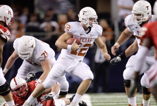 ARLINGTON, TX - DECEMBER 5: Colt McCoy #12 of the Texas Longhorns runs the ball during the Big 12 Football Championship game against the Nebraska Cornhuskers at Cowboys Stadium on December 5, 2009 in Arlington, Texas. (Photo by Jamie Squire/Getty Images)