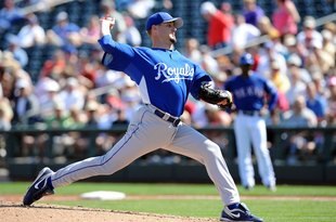 SURPRISE, AZ - MARCH 06:  Gil Meche #55 of the Kansas City Royals pitches during a Spring Training game against the Texas Rangers on March 6, 2010 in Surprise, Arizona.  (Photo by Lisa Blumenfeld/Getty Images)