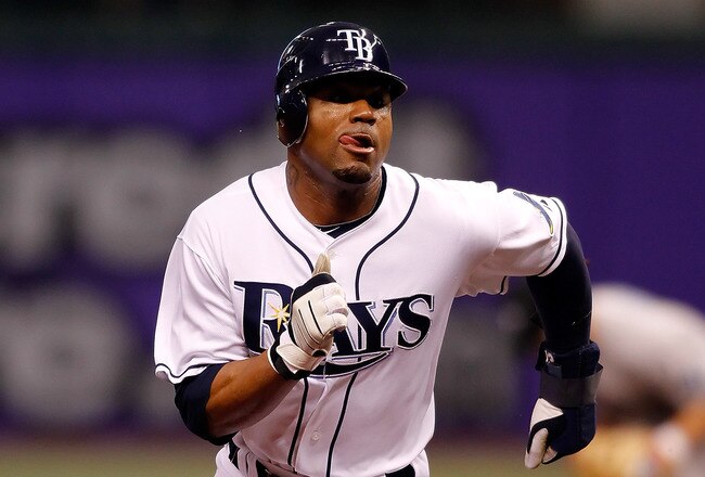 ST PETERSBURG, FL - APRIL 24:  Outfielder Carl Crawford #13 of the Tampa Bay Rays advances against the Toronto Blue Jays during the game at Tropicana Field on April 24, 2010 in St. Petersburg, Florida.  (Photo by J. Meric/Getty Images)