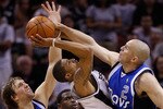 SAN ANTONIO - APRIL 25:  Guard George Hill #3 of the San Antonio Spurs takes a shot against Jason Kidd #2 and Dirk Nowitzki #41 of the Dallas Mavericks in Game Four of the Western Conference Quarterfinals during the 2010 NBA Playoffs at AT&T Center on April 25, 2010 in San Antonio, Texas. NOTE TO USER: User expressly acknowledges and agrees that, by downloading and or using this photograph, User is consenting to the terms and conditions of the Getty Images License Agreement.  (Photo by Ronald Martinez/Getty Images)